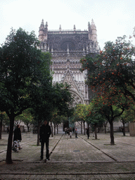 Tim at the east side of the Seville Cathedral with the Puerta de la Concepción gate and orange trees at the Patio de los Naranjos courtyard