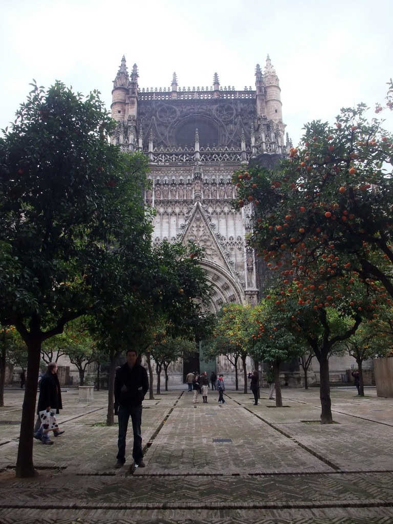 Tim at the east side of the Seville Cathedral with the Puerta de la Concepción gate and orange trees at the Patio de los Naranjos courtyard