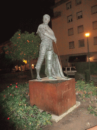 Statue of Curro Romero in front of the Plaza de Toros de la Real Maestranza de Caballería de Sevilla bullring, by night
