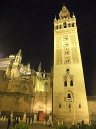 The east side of the Seville Cathedral with the Giralda tower at the Plaza del Triunfo square, by night