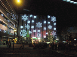 Lights on the El Corte Inglés shopping mall at the Calle de Luis Montoto street, by night