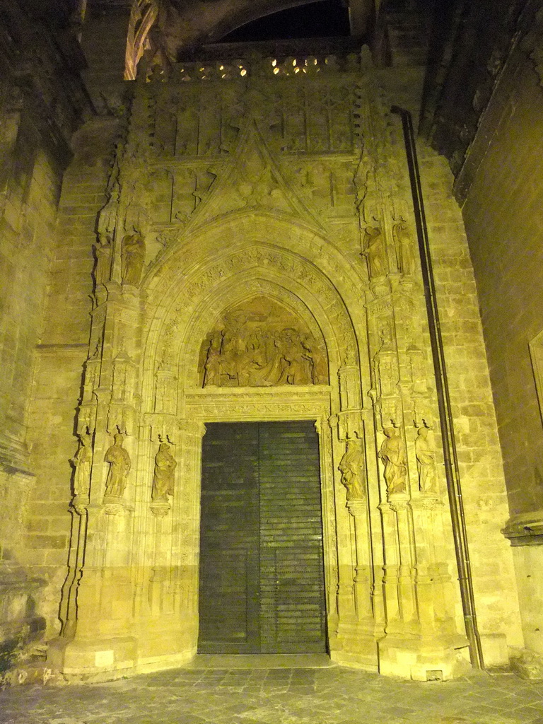 The Puerta de Campanillas gate at the east side of the Seville Cathedral, by night