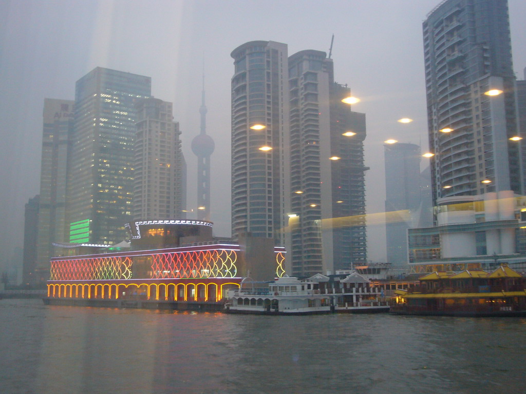 The Pudong district with the Oriental Pearl Tower and restaurant boats, viewed from the Huangpu river ferry