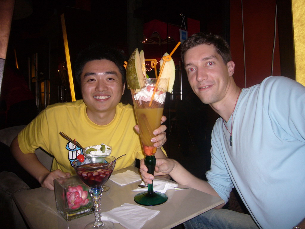 Tim and Miaomiao`s friend having a cocktail in a cocktail bar in the city center