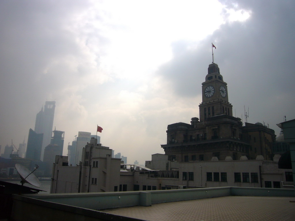 The Shanghai Customs House and the skyline of the Pudong district, with the Jin Mao Tower and the Shanghai World Financial Center (under construction), viewed from the roof of the Ambassador Hotel