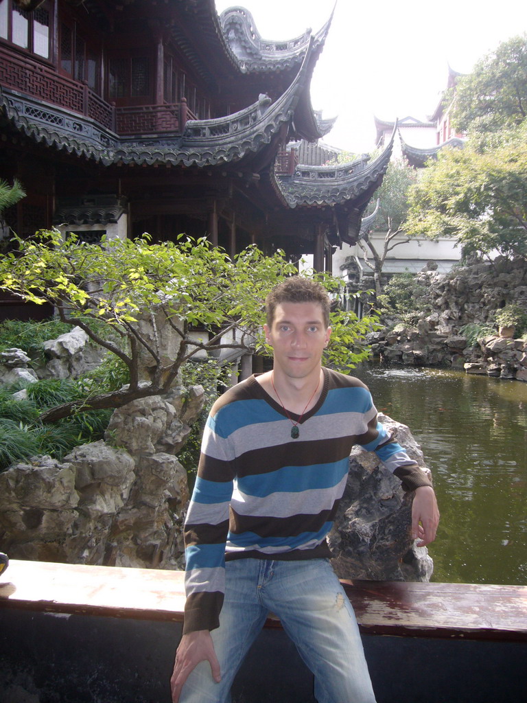 Tim with pavilions and pool in the Yuyuan Garden in the Old Town