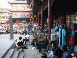 People performing a Chinese Opera at the shopping area just outside of the Temple of the Town Gods