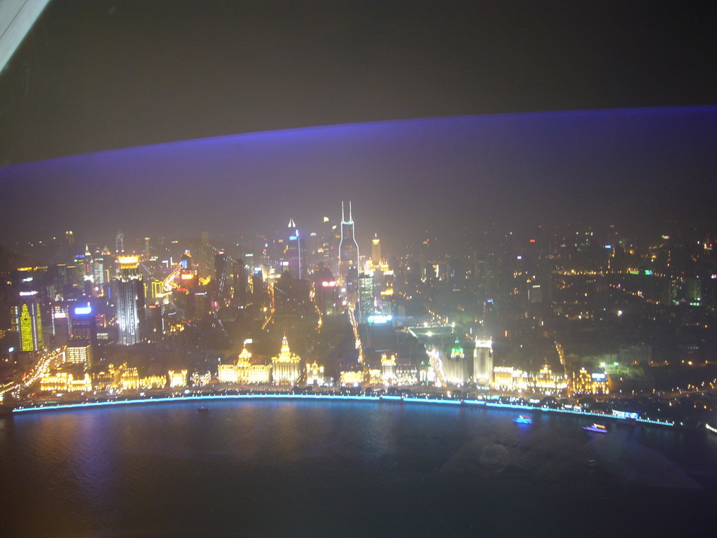 View on the Puxi skyline and the Bund area, with the Bund Center, Tomorrow Square, Le Royal Méridien Shanghai and other skyscrapers, from the top of the Oriental Pearl Tower, by night