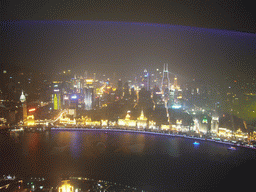 View on the Puxi skyline and the Bund area, with the Guang Ming Building, the Bund Center, Tomorrow Square, Le Royal Méridien Shanghai and other skyscrapers, from the top of the Oriental Pearl Tower, by night