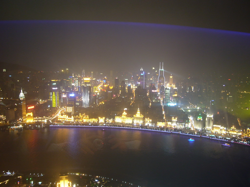 View on the Puxi skyline and the Bund area, with the Guang Ming Building, the Bund Center, Tomorrow Square, Le Royal Méridien Shanghai and other skyscrapers, from the top of the Oriental Pearl Tower, by night