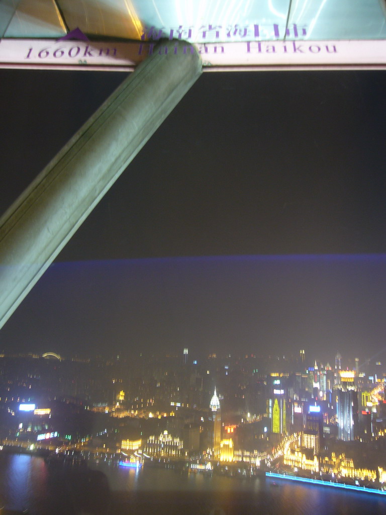 View on the Puxi skyline, with the Guang Ming Building, the Bund Center and other skyscrapers, from the top of the Oriental Pearl Tower, by night