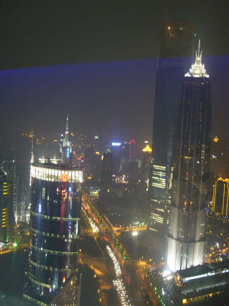 View on the the Jin Mao Tower, the Bank of China Tower and the Shanghai World Financial Center (under construction), from the top of the Oriental Pearl Tower, by night