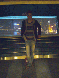 Tim at the top of the Oriental Pearl Tower, with a view on the Puxi skyline with the Guang Ming Building, by night