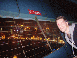 Tim at the top of the Oriental Pearl Tower, with a view on the Puxi skyline and the Bund area, with the Guang Ming Building, the Bund Center, Tomorrow Square and Le Royal Méridien Shanghai, by night