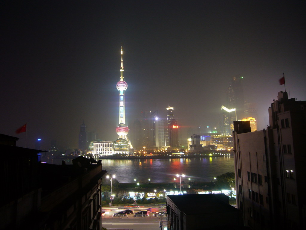 Skyline of the Pudong district, with the Oriental Pearl Tower, the Jin Mao Tower and the Shanghai World Financial Center (under construction), viewed from the roof of the Ambassador Hotel, by night