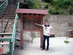 Tim at warning sign at Tiger Leaping Gorge