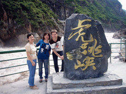 Tim, Miaomiao and Miaomiao`s mother with monument stone at Tiger Leaping Gorge