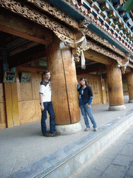 Tim and Miaomiao with a wooden pillar of a Tibetan buddhism temple