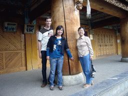 Tim, Miaomiao and Miaomiao`s mother with a wooden pillar of a Tibetan buddhism temple