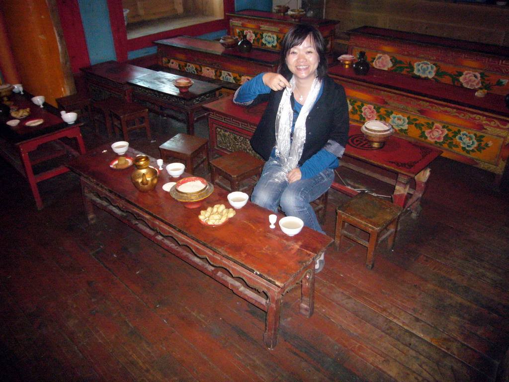 Miaomiao having a local Tibetan drink