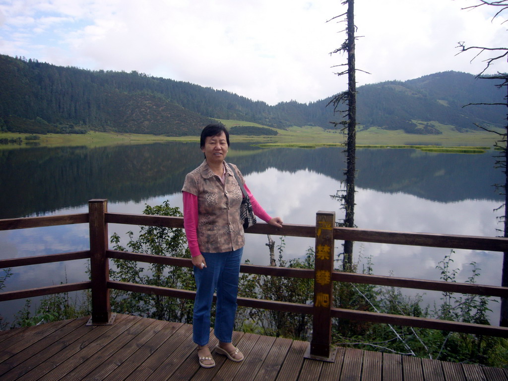 Miaomiao`s mother at Shudu Lake in Potatso National Park