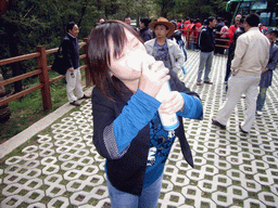 Miaomiao with oxygen bottle in Potatso National Park