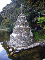 Stupa at waterside of Bita Lake in Potatso National Park