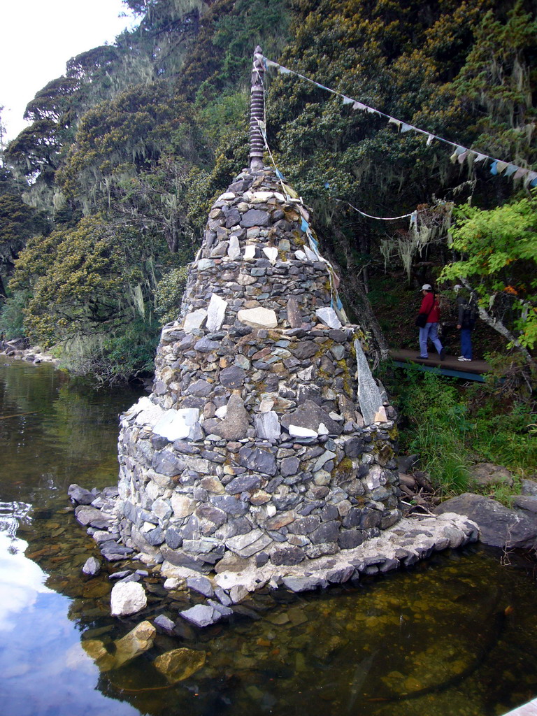 Stupa at waterside of Bita Lake in Potatso National Park
