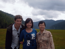 Tim, Miaomiao and Miaomiao`s mother at grassland in Potatso National Park