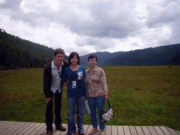 Tim, Miaomiao and Miaomiao`s mother at grassland in Potatso National Park