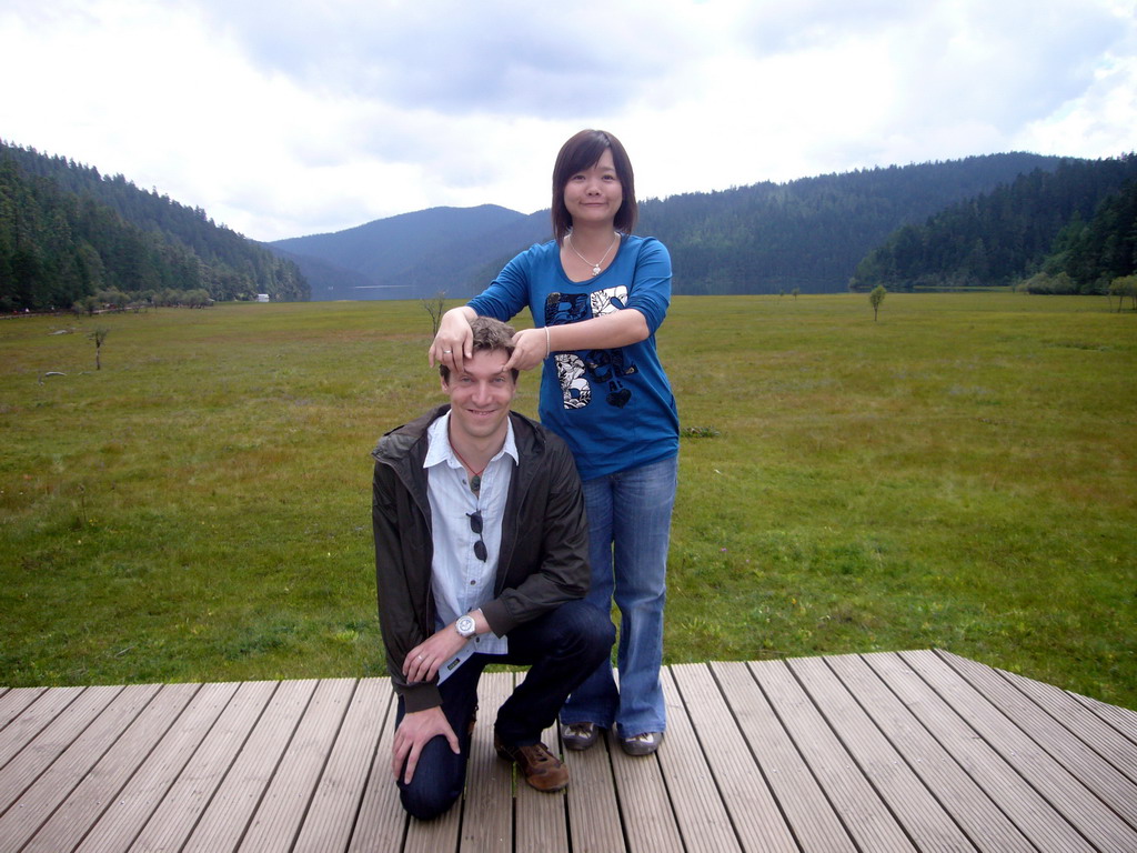 Tim and Miaomiao at grassland in Potatso National Park