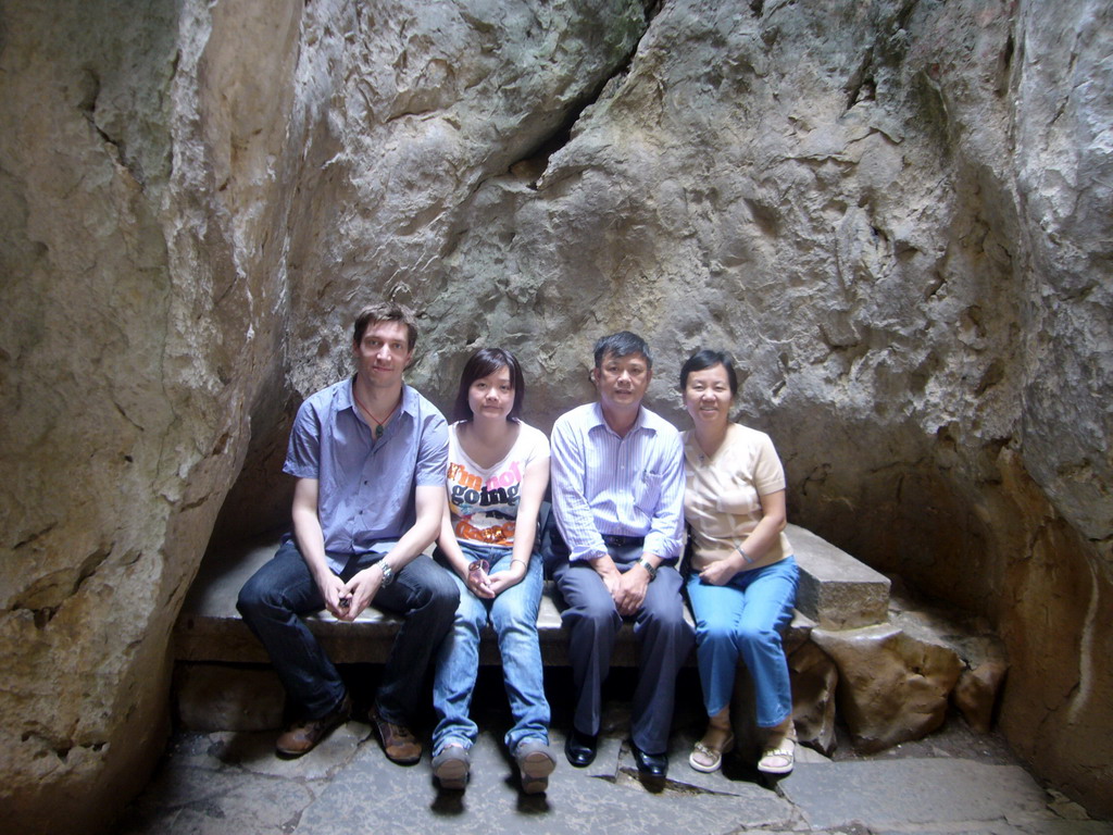 Tim, Miaomiao and Miaomiao`s parents on a bench in the Major Stone Forest of Shilin National Park