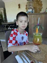 Max with a mocktail at Conny`s Restaurant