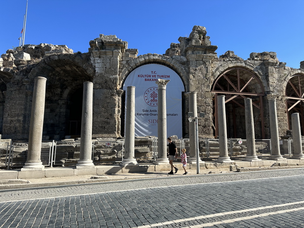 Tim and Max in front of the Temple of Dionysos and the northwest side of the Roman Theatre of Side at the Liman Caddesi street