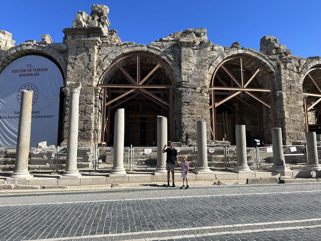 Tim and Max in front of the Temple of Dionysos and the northwest side of the Roman Theatre of Side at the Liman Caddesi street