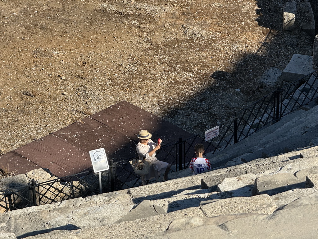 Miaomiao and Max at the bottom of the southwest auditorium of the Roman Theatre of Side, viewed from the diazoma of the west auditorium