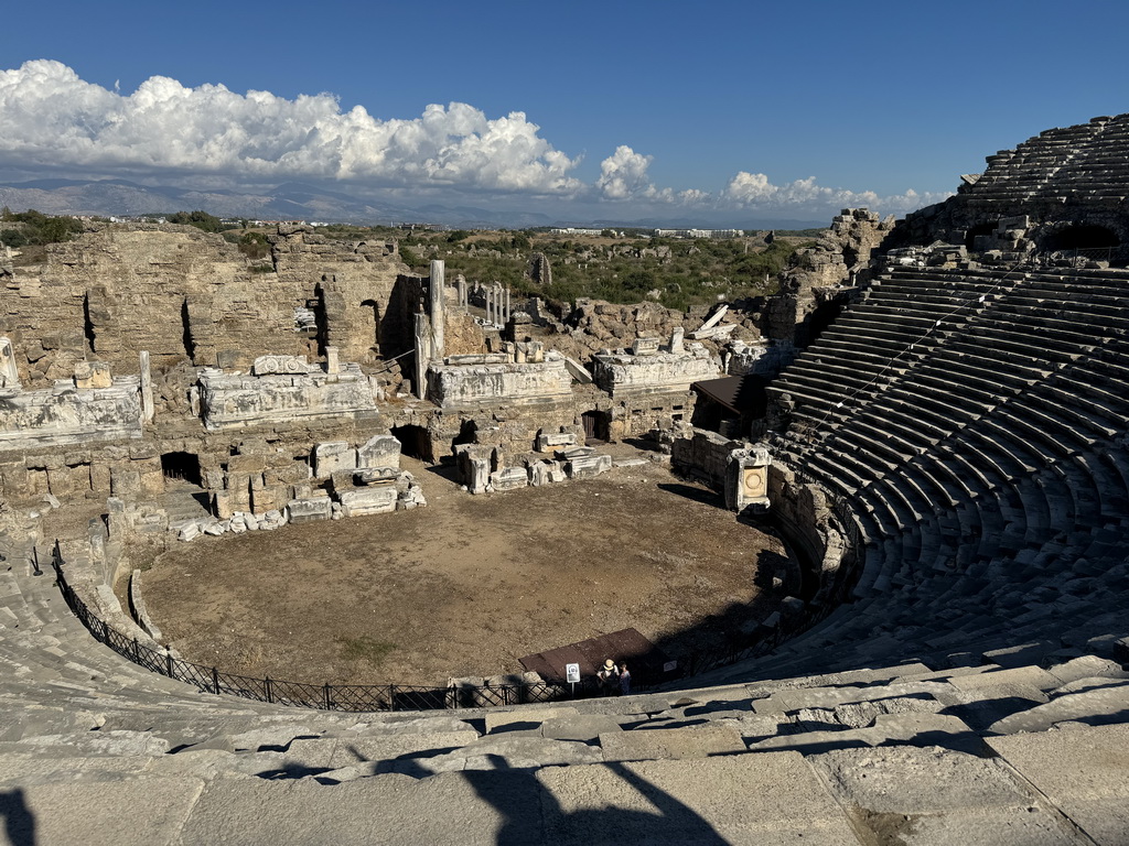 Miaomiao and Max at the southwest auditorium of the Roman Theatre of Side, with a view on the orchestra, stage and stage building, viewed from the diazoma of the west auditorium