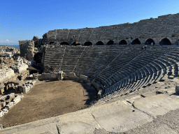 Miaomiao and Max at the southwest auditorium of the Roman Theatre of Side, with a view on the orchestra, stage and stage building, viewed from the diazoma of the northwest auditorium