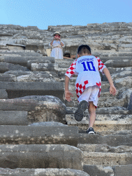 Max climbing to Miaomiao at the diazoma of the southwest auditorium of the Roman Theatre of Side, viewed from the bottom