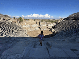 Max at the diazoma of the southwest auditorium of the Roman Theatre of Side, with a view on the auditorium, orchestra, stage and stage building