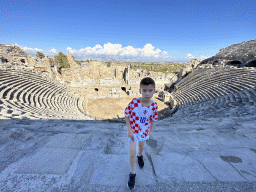 Max at the diazoma of the southwest auditorium of the Roman Theatre of Side, with a view on the auditorium, orchestra, stage and stage building