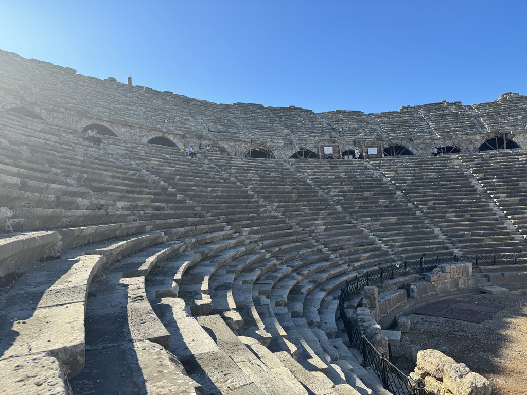 Miaomiao at the diazoma of the southwest auditorium of the Roman Theatre of Side, with a view on the orchestra, viewed from the south auditorium