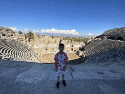 Max at the diazoma of the southwest auditorium of the Roman Theatre of Side, with a view on the auditorium, orchestra, stage and stage building