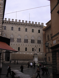 Front of the Salimbeni Palace and a statue of Sallustio Bandini at the Piazza Salimbeni square