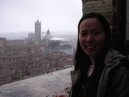 Miaomiao`s friend at the top of the Tower of Mangia, with a view on the Siena Cathedral and its Bell Tower