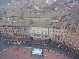 The Piazza del Campo square with the Gaia Fountain and the Loggia della Mercanzia building, viewed from the top of the Tower of Mangia