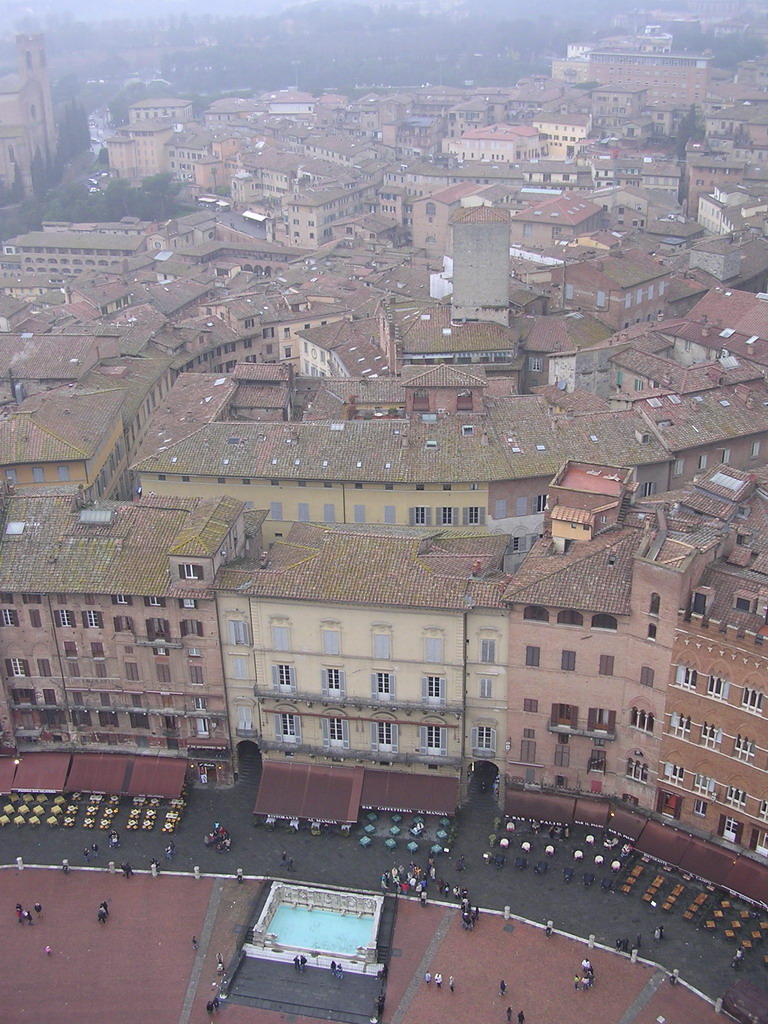 The Piazza del Campo square with the Gaia Fountain and the Loggia della Mercanzia building, viewed from the top of the Tower of Mangia