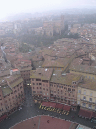 The Piazza del Campo square and the Basilica Cateriniana San Domenico church, viewed from the top of the Tower of Mangia