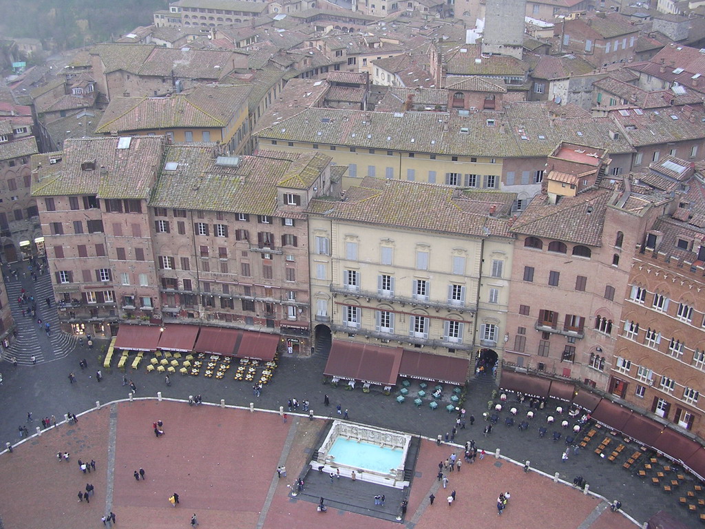 The Piazza del Campo square with the Gaia Fountain and the Loggia della Mercanzia building, viewed from the top of the Tower of Mangia