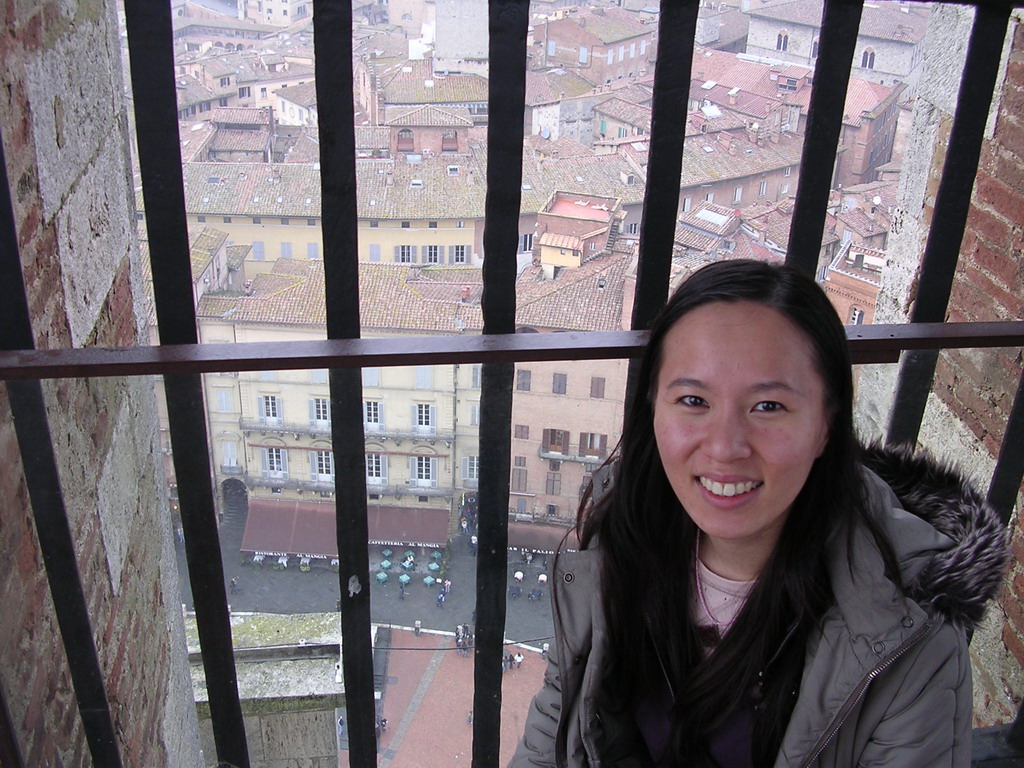 Miaomiao`s friend at the top of the Tower of Mangia, with a view on the Piazza del Campo square with the Gaia Fountain and the Loggia della Mercanzia building